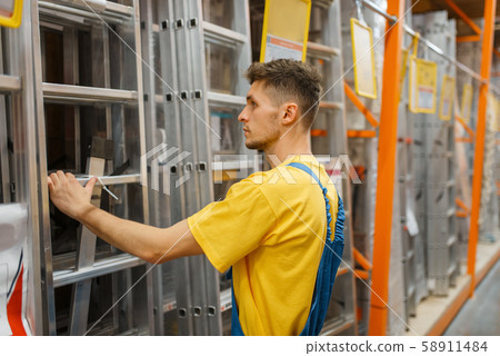 Constructor choosing the stairs in hardware store 58911484