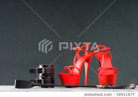BDSM outfit for adult sex games. Red high-heeled 58911877