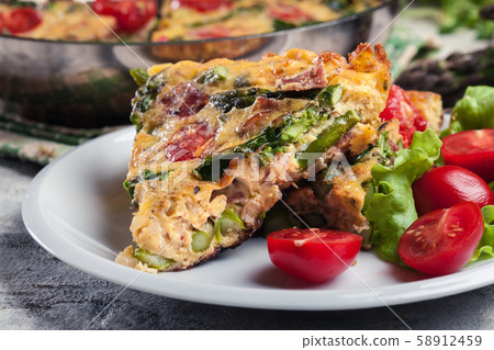 Frittata made of eggs, asparagus and tomatoes Frittata made of eggs, asparagus and tomatoes 58912459