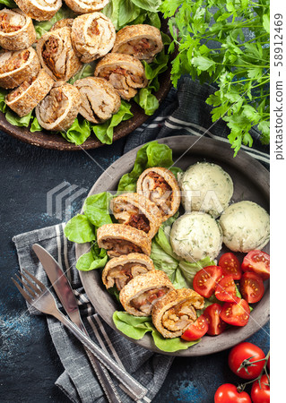 Pork rolls stuffed with mozzarella 58912469