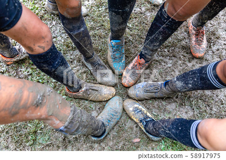 Girls soccer shoes covered with mud Girls soccer shoes covered with mud 58917975