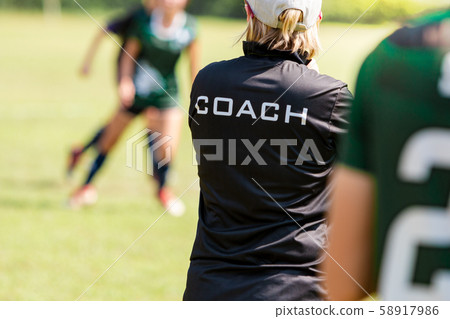 Back view of a female soccer, football, coach 58917986