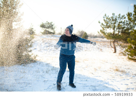 Loving couple play snowballs in winter in the Loving couple play snowballs in winter in the 58919933