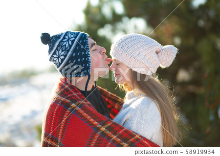 Winter walk through the woods. The guy with the Winter walk through the woods. The guy with the 58919934