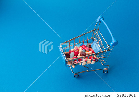 Cart from the supermarket filled with colored Cart from the supermarket filled with colored 58919961
