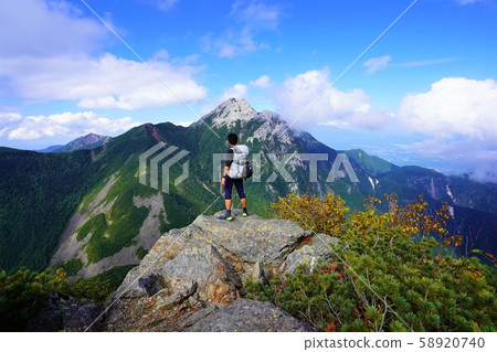 Climber looking at Mount Komagatake from Mount Kurizawa Climber looking at Mount Komagatake from Mount Kurizawa 58920740