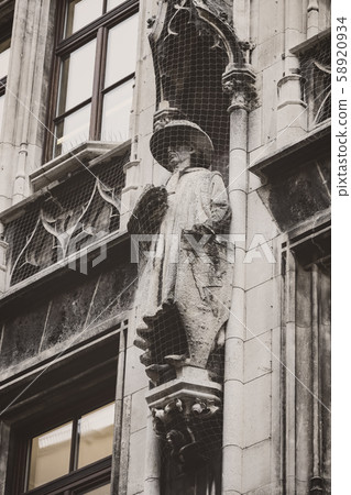 Elements of architecture and statues of the new city hall on Marienplatz in the center of Munich.  58920934