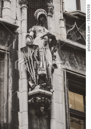 Elements of architecture and statues of the new city hall on Marienplatz in the center of Munich.  58920936