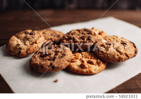 Chocolate cookies on wooden table. Chocolate chip Chocolate cookies on wooden table. Chocolate chip 58921031