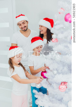 Family members preparing for Christmas together at home 58921903