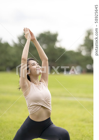 Yoga Relaxing feeling in turf park (hero's pose) Expected to reduce stress on lower body and trunk Yoga Relaxing feeling in turf park (hero's pose) Expected to reduce stress on lower body and trunk 58925645