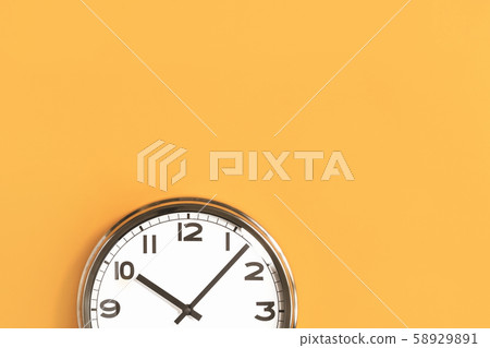 Part of big wall clock on orange background 58929891