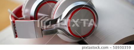 Headphones are on the table in the office Headphones are on the table in the office 58930359
