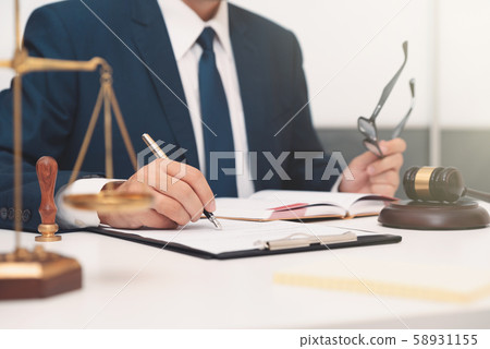 Lawyer or attorney working with papers in office Lawyer or attorney working with papers in office 58931155