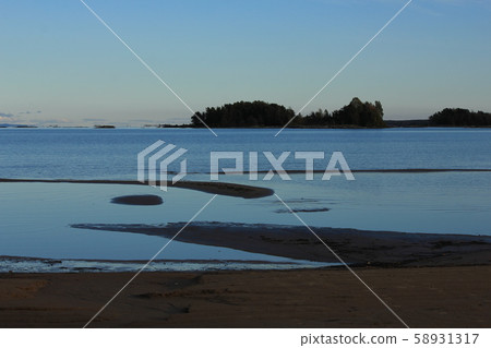 Natural shapes on a sand beach in Mellerud. 58931317