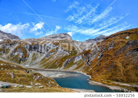 Beautiful alpine mountains. Fresh clean air. On the tops of the mountains lies snow all year round Beautiful alpine mountains. Fresh clean air. On the tops of the mountains lies snow all year round 58932256