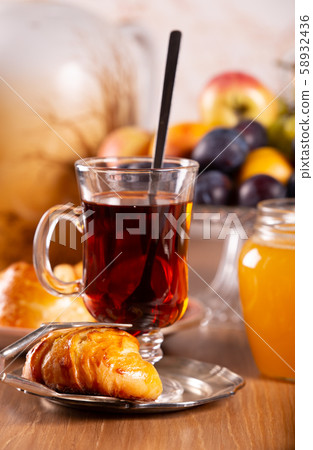 Fresh, tasty buns and tea with honey 58932436