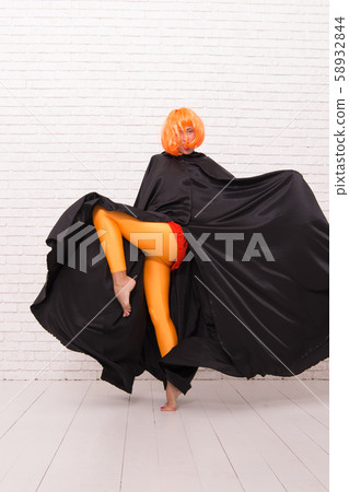 Girl with long fit legs in orange tights dancing. Girl with long fit legs in orange tights dancing. 58932844