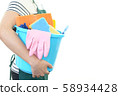 A woman with a cleaning tool 58934428