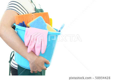 A woman with a cleaning tool 58934428