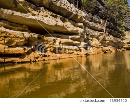 Impressive stone formations reflected on Manambolo river, Tsingy de Bemaraha Strict Nature Reserve, Madagascar  58934520
