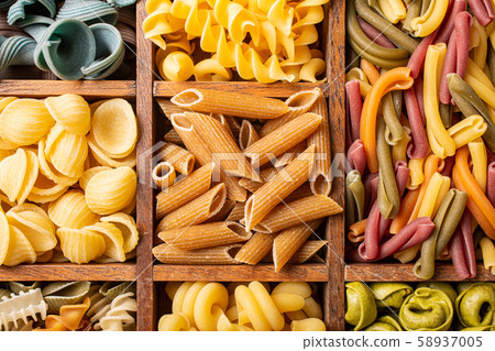 Assorted colorful italian pasta in wooden box Assorted colorful italian pasta in wooden box 58937005