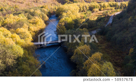 Top view of the taiga forest, river, road . The vast expanses of Eastern Siberia. far East Russia Top view of the taiga forest, river, road . The vast expanses of Eastern Siberia. far East Russia 58937678
