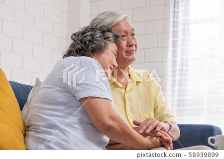 Close up Asian senior couple encouraging together by holding hand each other 58939899