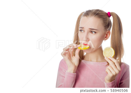 woman eats lemon 58940506