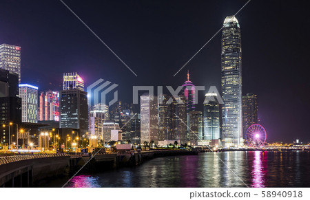 Hong Kong -July 15, 2019: Hong Kong cityscape at night. View From Victoria Harbour Hong Kong -July 15, 2019: Hong Kong cityscape at night. View From Victoria Harbour 58940918