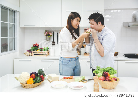 Young couple cooking together 58941385
