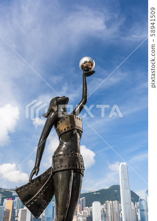Tourists visiting the Avenue of the Stars. The Avenue of Stars is located along the Victoria Harbor in Hong Kong.  Tourists visiting the Avenue of the Stars. The Avenue of Stars is located along the Victoria Harbor in Hong Kong.  58941509