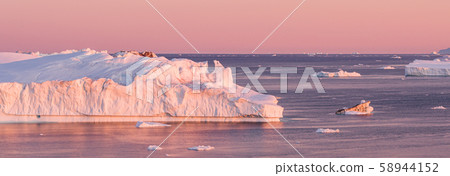 Global Warming and Climate Change - Icebergs from melting glacier in icefjord 58944152