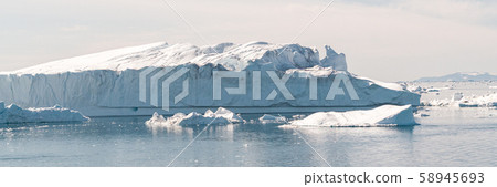 Global Warming and Climate Change - Icebergs from melting glacier in icefjord Global Warming and Climate Change - Icebergs from melting glacier in icefjord 58945693