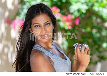 Asian Indian Woman Girl Outdoors Taking Photographs With A Retro Style Camera 58948221
