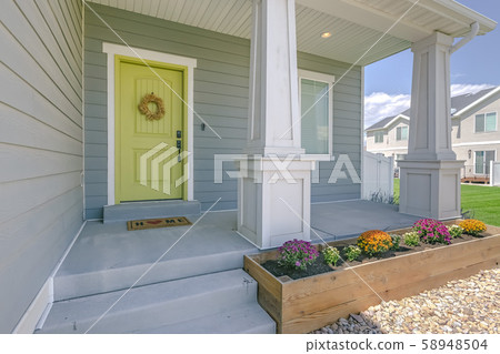 Facade of lovely home viewed on bright sunny day Facade of lovely home viewed on bright sunny day 58948504