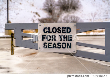 Closed For The Season sign on a gate Closed For The Season sign on a gate 58948643