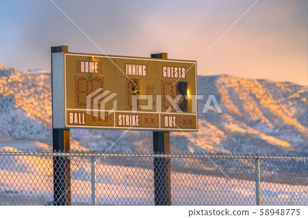 Baseball scoreboard in Eagle Mountain at sunset 58948775