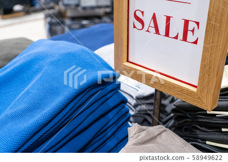 Sale sign in a men's clothing store. Sale sign in a men's clothing store. 58949622