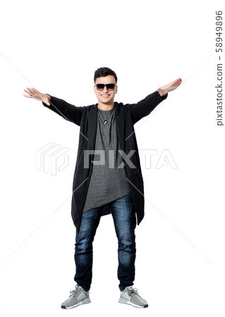 Casual young man wearing sunglasses, hands up, happy, positive a 58949896
