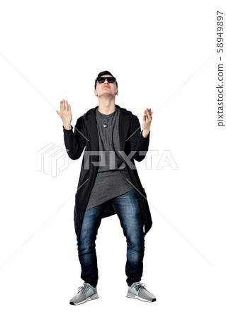 Casual young man wearing sunglasses, hands up, happy, positive a 58949897