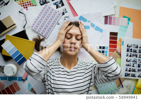 Frustrated Student lying on Floor 58949941