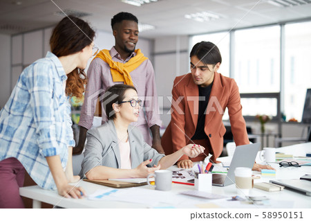 Young Business Team Working in Office Young Business Team Working in Office 58950151