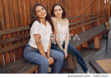 Two pretty girls in a summer park Two pretty girls in a summer park 58951422