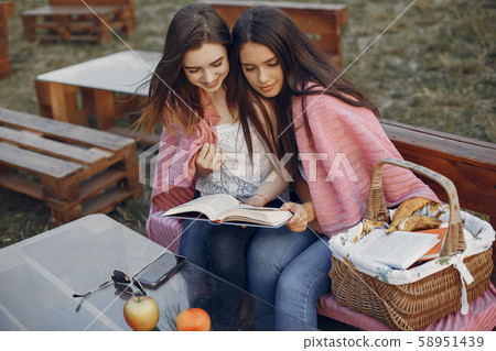 Two pretty girls in a summer park 58951439