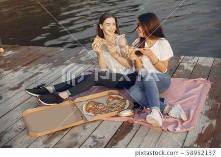 Two pretty girls in a summer park 58952137