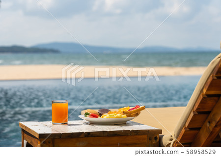 Summer holiday with sandwiches, cake and fruit juice 58958529