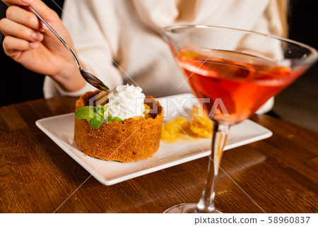 woman eating dessert with pineapple 58960837