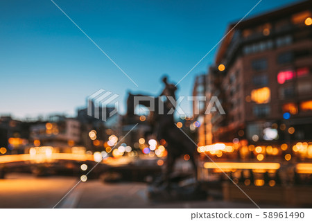 Oslo, Norway. Night Abstract Boke Bokeh Background Effect. Horse Statue On The Street And Oslo, Norway. Night Abstract Boke Bokeh Background Effect. Horse Statue On The Street And 58961490