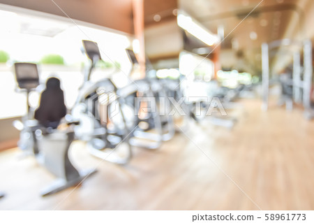 Blur gym background fitness center or health club with blurry sports exercise equipment for aerobic workout and bodybuilding 58961773